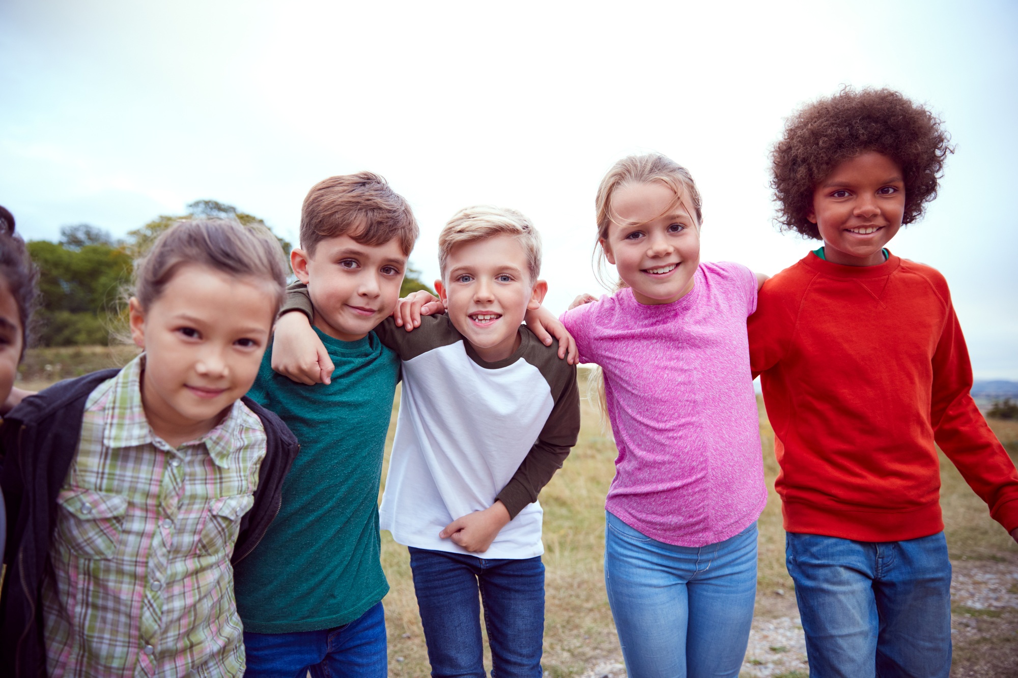 Portrait Of Children On Outdoor Activity Camping Trip Having Fun Playing Game Together