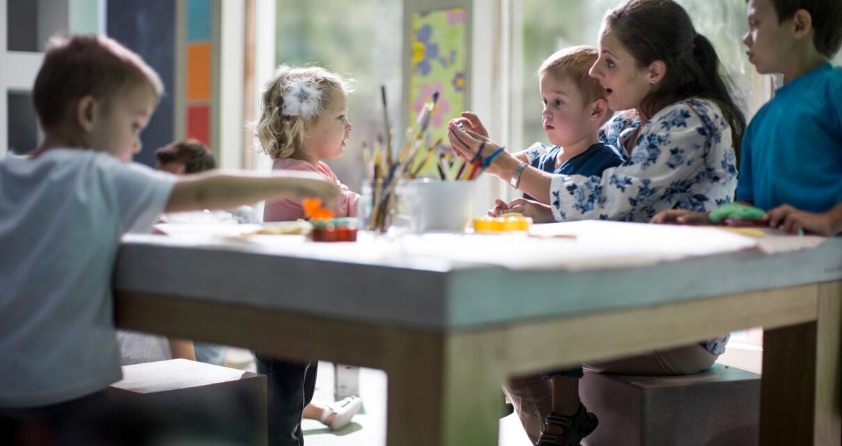 Teacher and children drawing