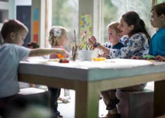 Teacher and children drawing