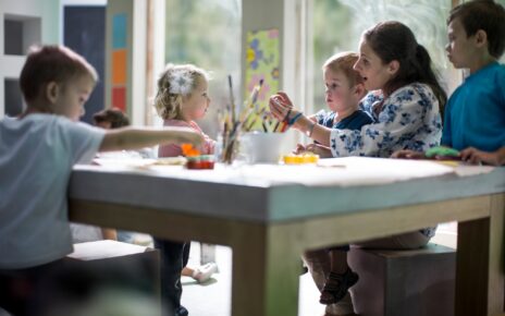 Teacher and children drawing