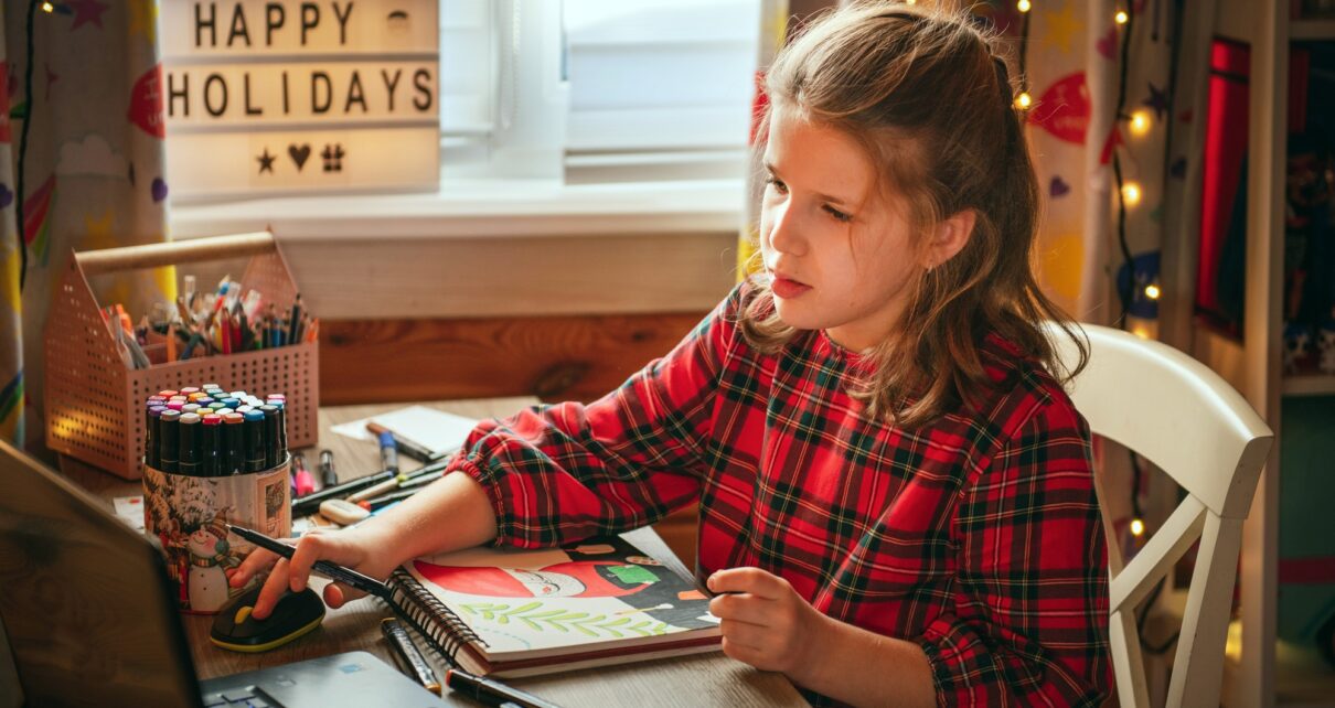 Teen girl having online drawing lesson.