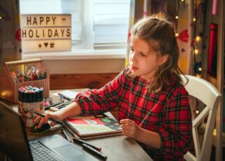 Teen girl having online drawing lesson.