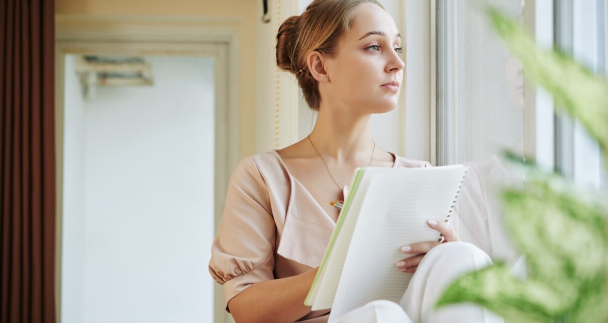 Creative woman writing poem