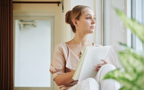 Creative woman writing poem