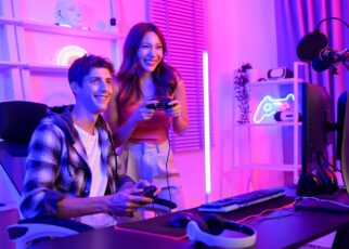 Young professionals play video games together live streaming