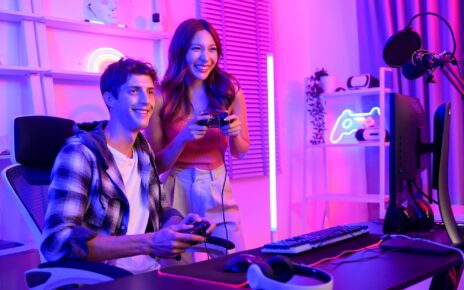 Young professionals play video games together live streaming